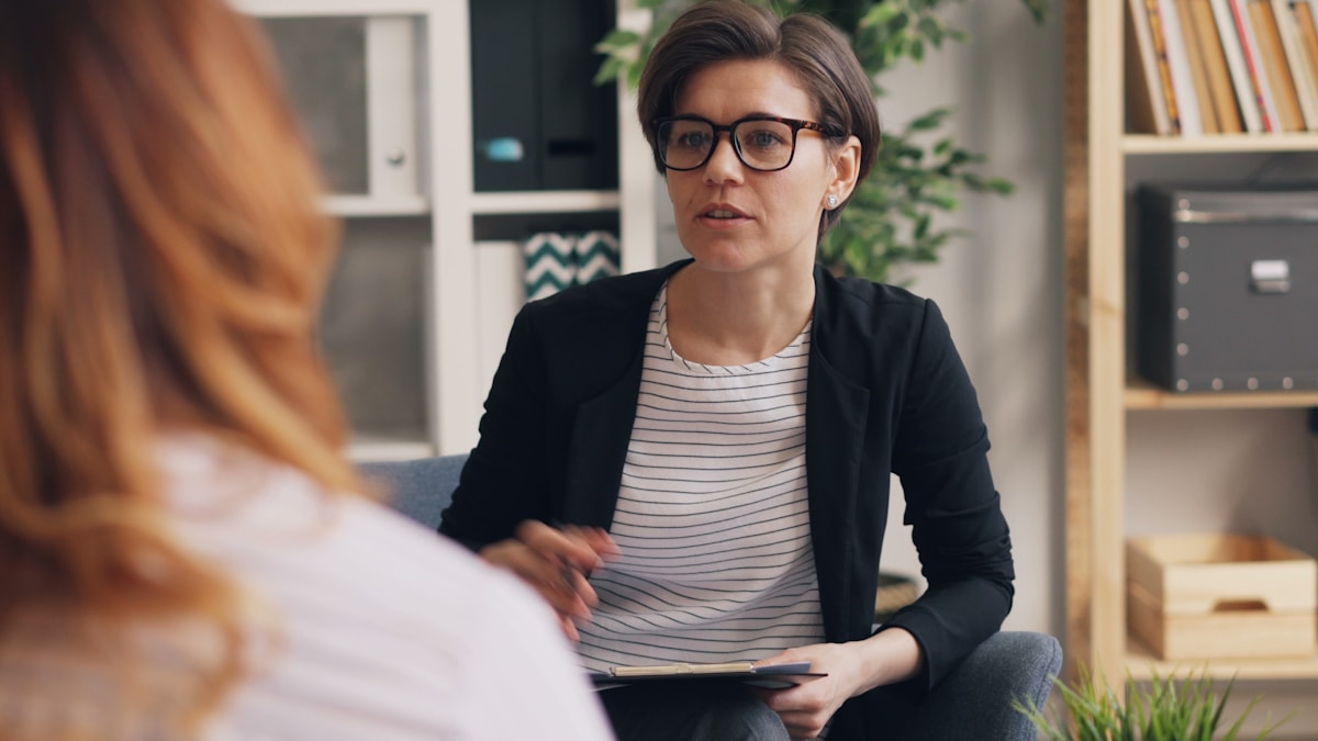 A clinician in a clinical setting, photographed for a report on therapy session pricing by state